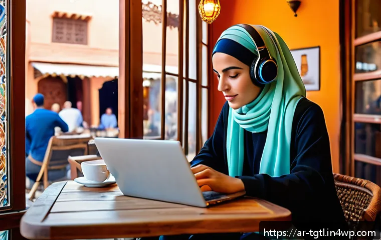디지털 노마드의 라이프스타일 변화 연구 - A focused Arab digital nomad woman working on a sleek laptop inside a cozy café in Marrakech, Morocc...